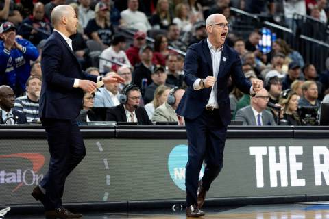 Connecticut Huskies head coach Dan Hurley cheers for his team as they keep a large lead during ...