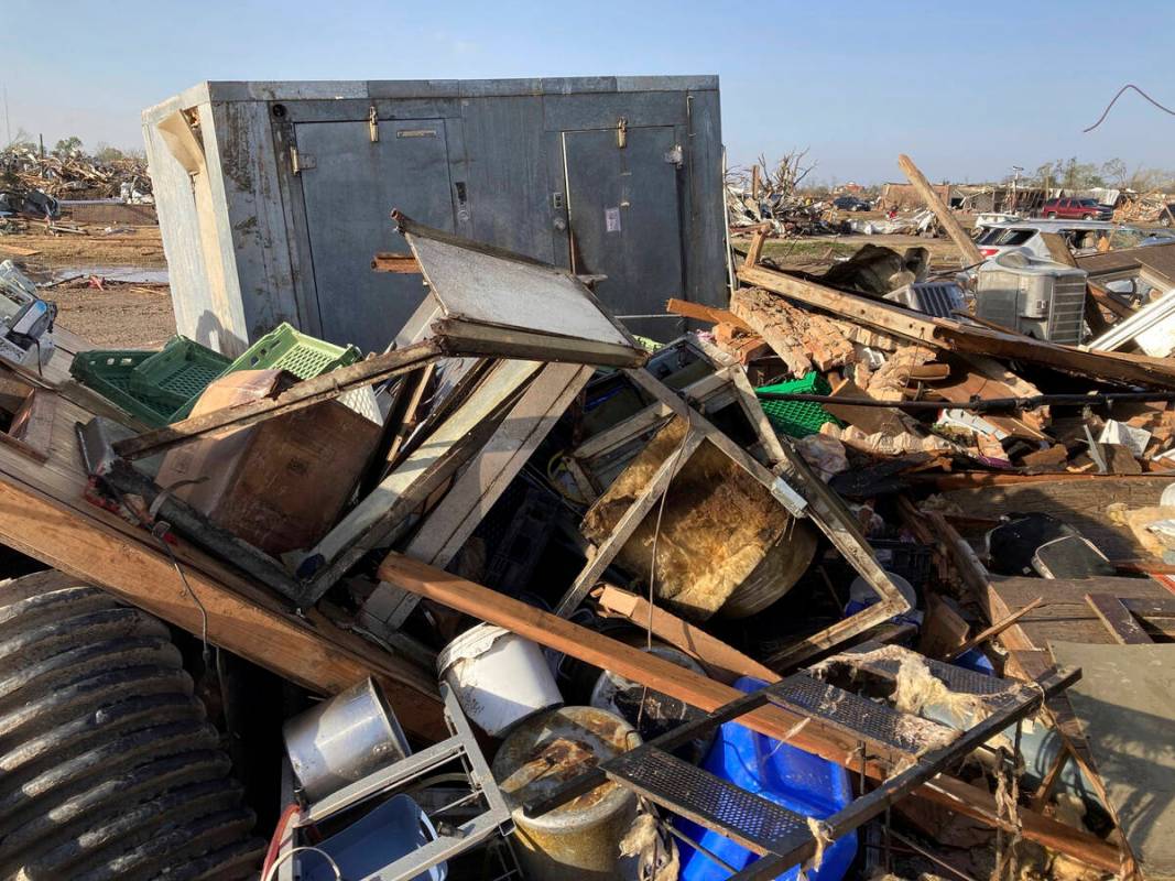 Debris covers the ground from a diner, Chuck’s dairy bar early Saturday, March 25, 2023 ...