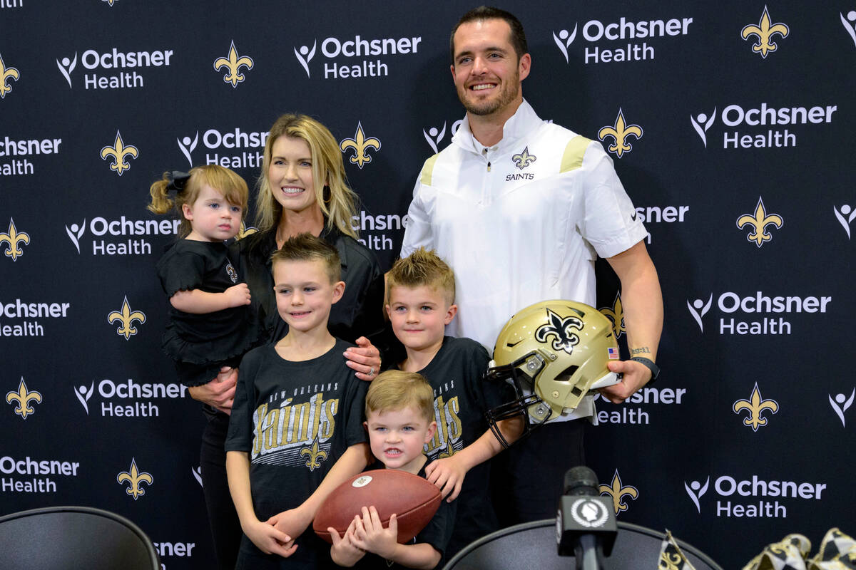Derek Carr, the new quarterback of the New Orleans Saints, is introduced with his family includ ...