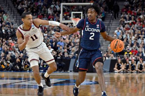 UConn guard Tristen Newton (2) handles the ball while defended by Gonzaga guard Nolan Hickman ( ...