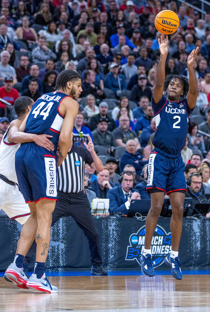 UConn guard Tristen Newton (2) gets off a 3 point shot over Gonzaga during the first half of th ...