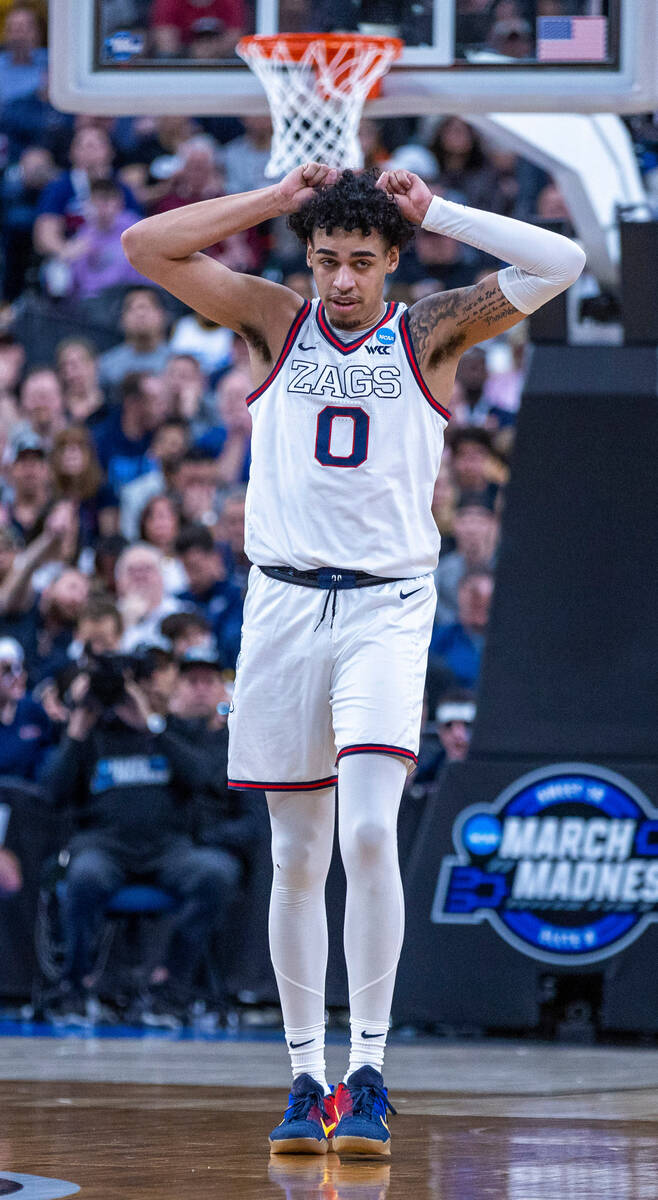 Gonzaga guard Julian Strawther (0) reacts to a missed basket over UConn during the first half o ...