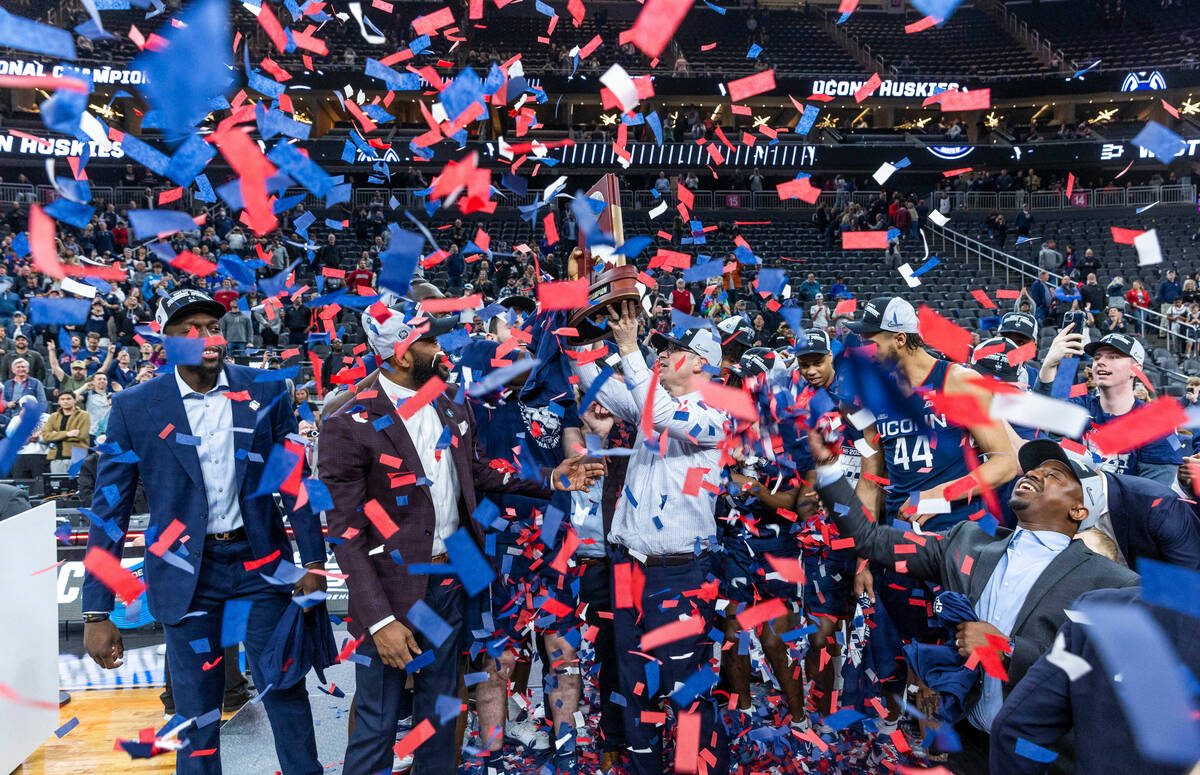UConn players and coaches celebrate their win over Gonzaga in their West Regional Elite 8 game ...