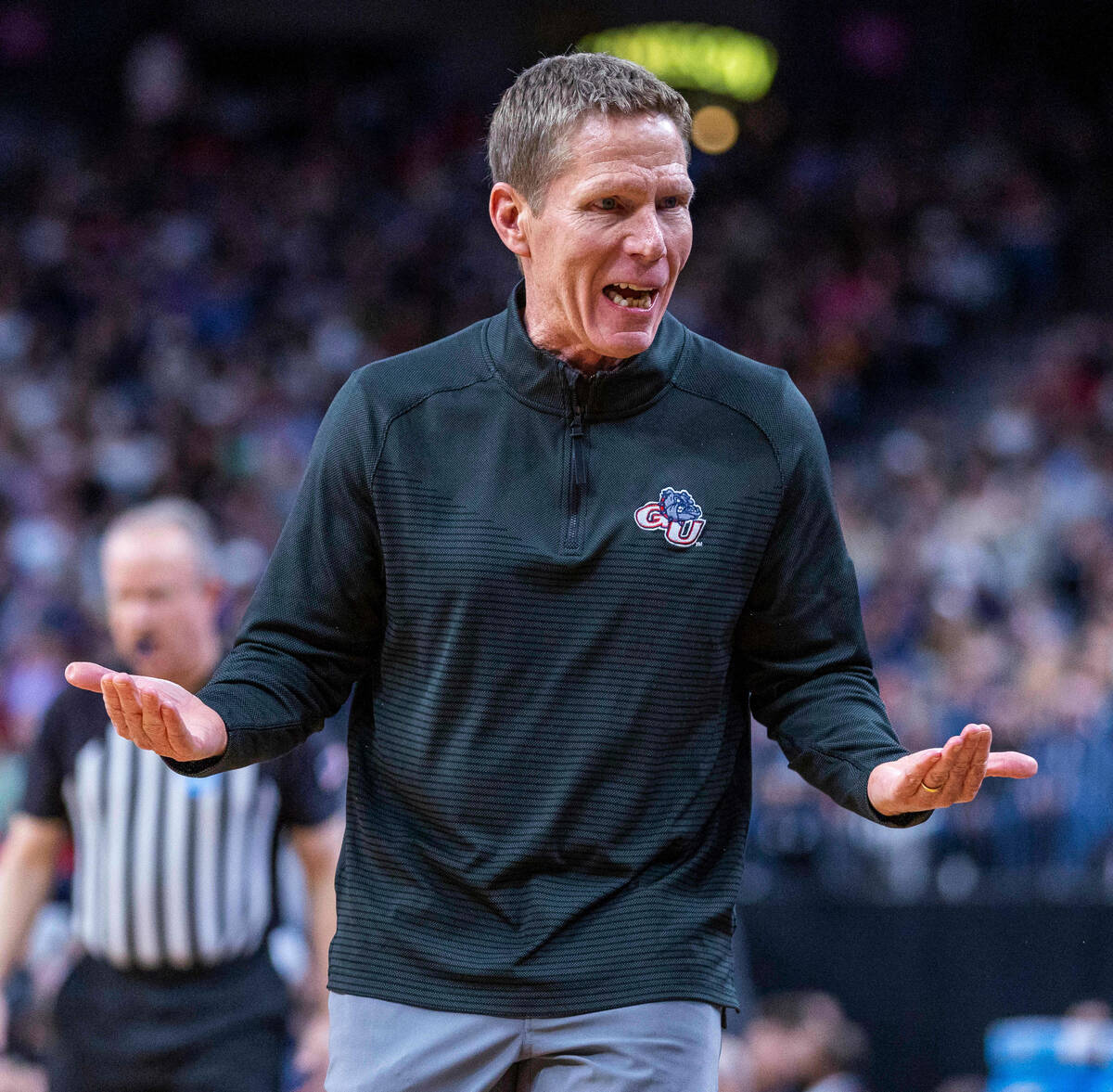 Gonzaga head coach Mark Few looks for some answers from his bench against UConn during the firs ...