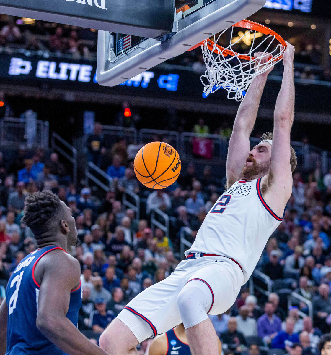 Gonzaga forward Drew Timme (2) dunks the ball over UConn forward Adama Sanogo (21) during the s ...