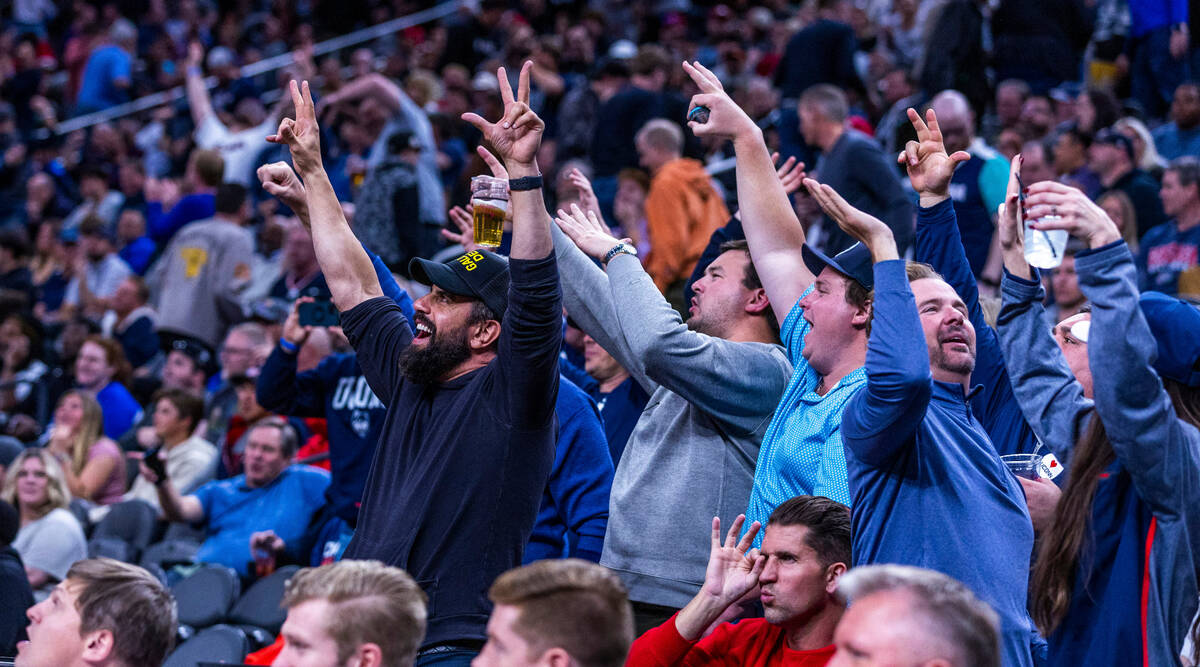UConn fans celebrate a dominating performance against Gonzaga during the first half of their We ...