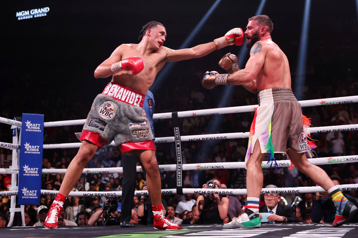 David Benavidez, left, throws a punch against Caleb Plant in the interim super middleweight tit ...
