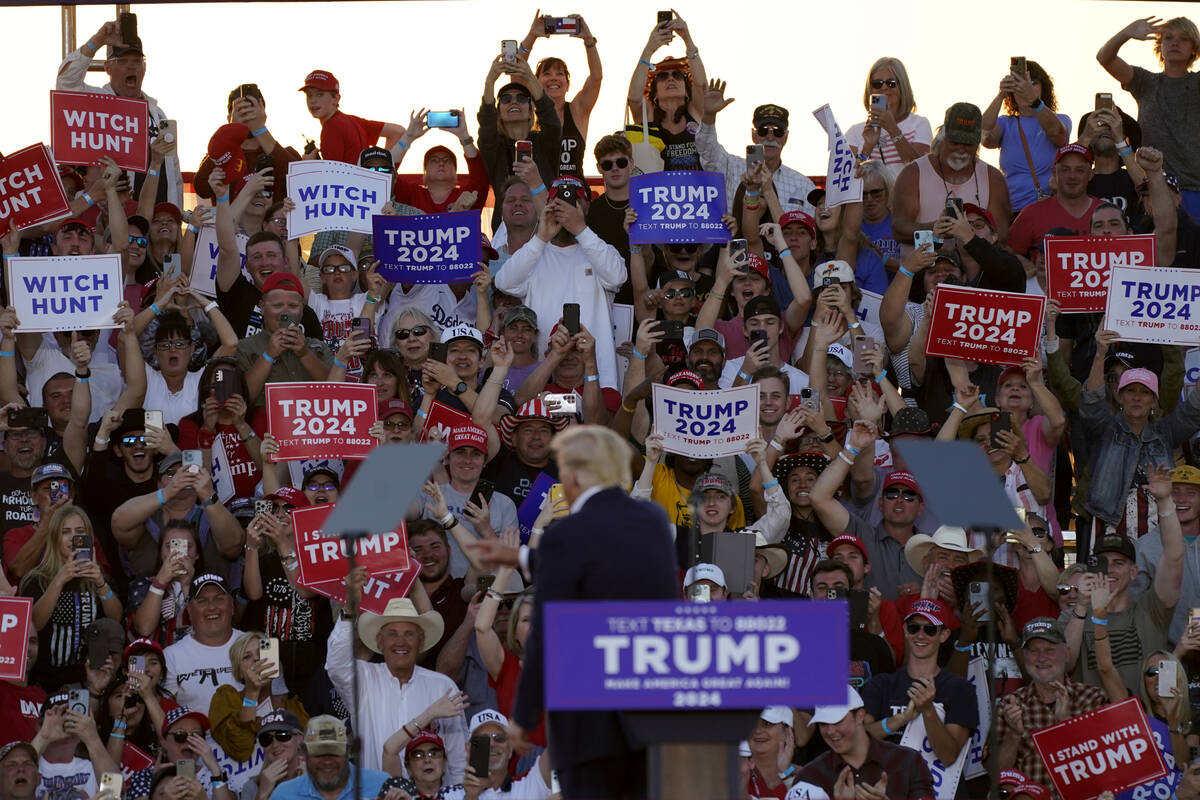 Supporters cheer former President Donald Trump as speaks at a campaign rally at Waco Regional A ...