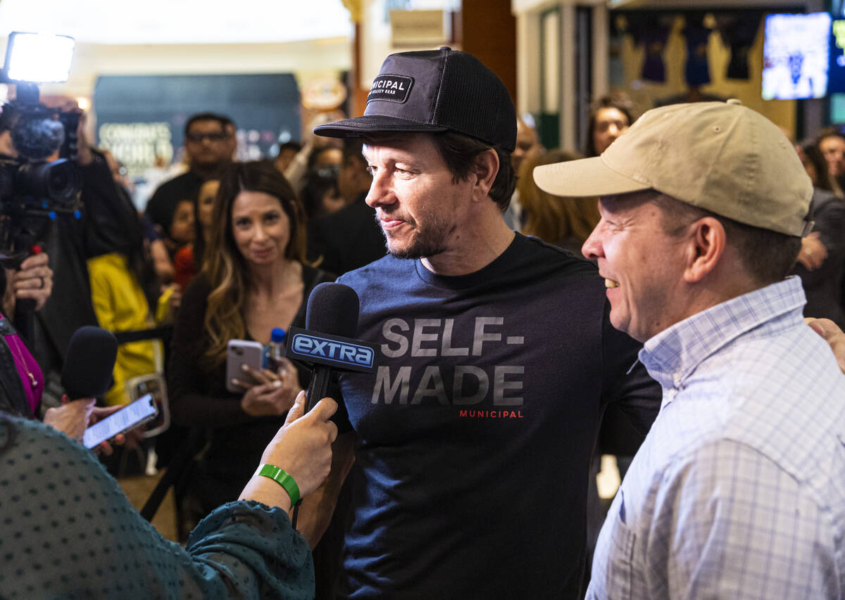 Brothers Mark Wahlberg, left, and Paul Wahlberg are interviewed during the opening celebration ...