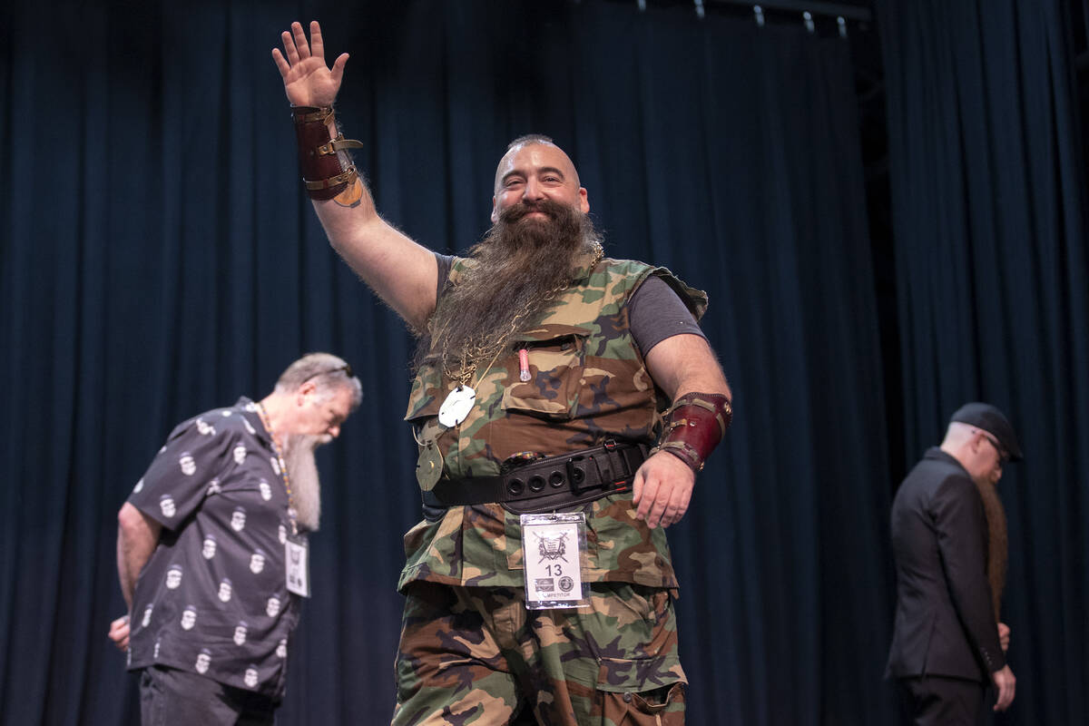 Mac waves to the crowd while participating in the goatee portion of the Battle Born Beard and M ...