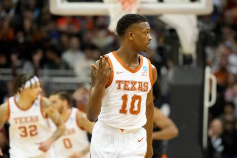 Texas guard Sir'Jabari Rice celebrates after scoring against Miami in the first half of an Elit ...