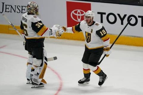 Vegas Golden Knights right wing Reilly Smith (19) celebrates with goaltender Logan Thompson (36 ...