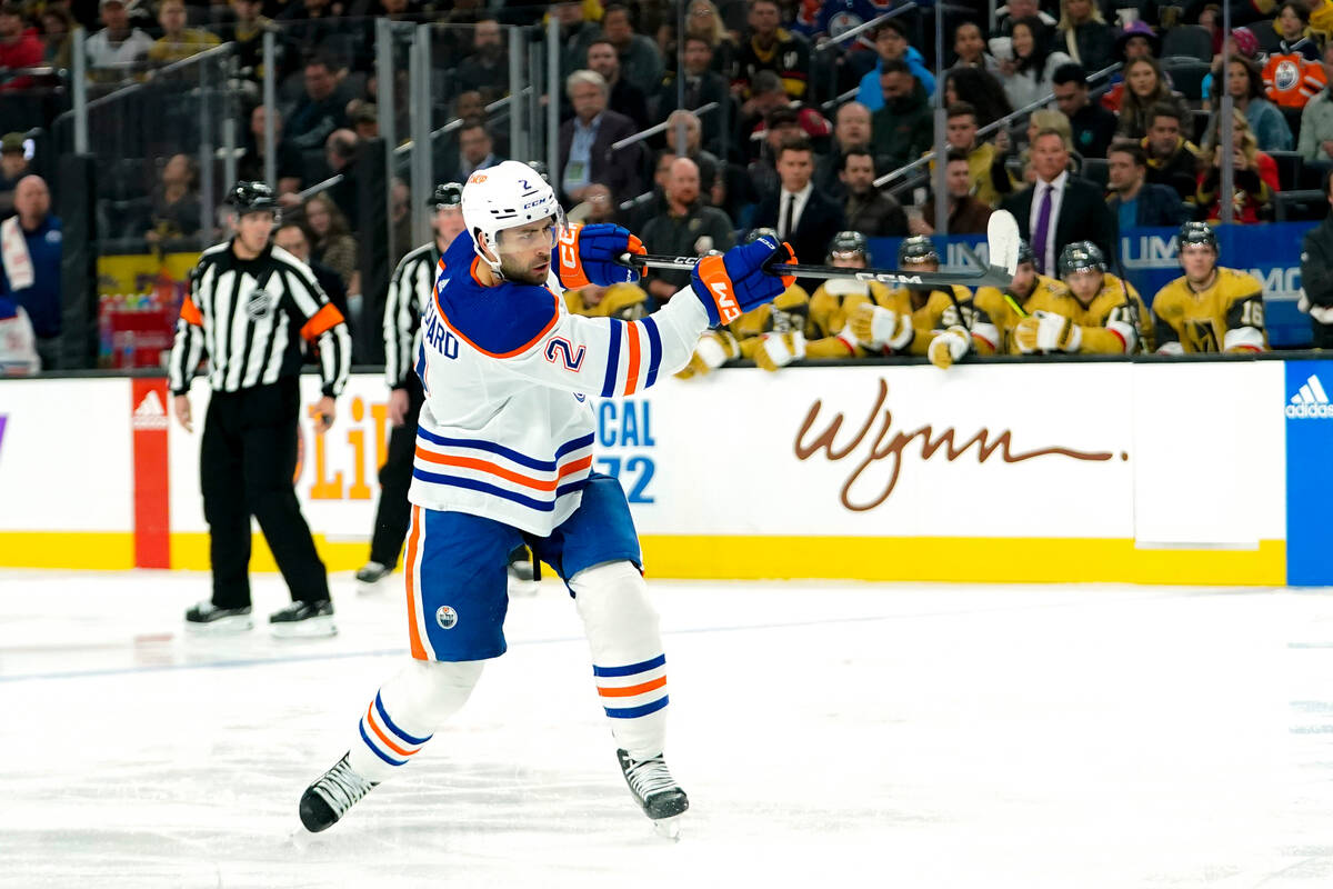 Edmonton Oilers defenseman Evan Bouchard follows through on a shot against the Vegas Golden Kni ...