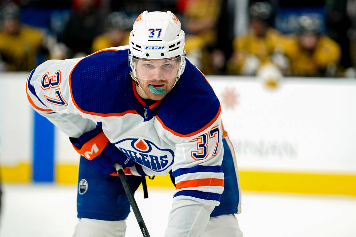 Edmonton Oilers left wing Warren Foegele waits for play to resume during the first period of th ...