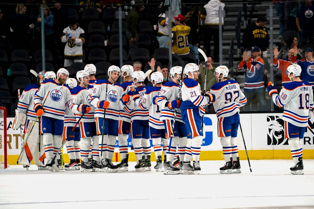 Edmonton Oilers celebrate after defeating the Vegas Golden Knights in an NHL hockey game Tuesda ...