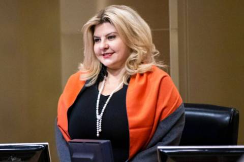 Las Vegas City Councilwoman Michele Fiore stands for invocation during a council meeting in Las ...