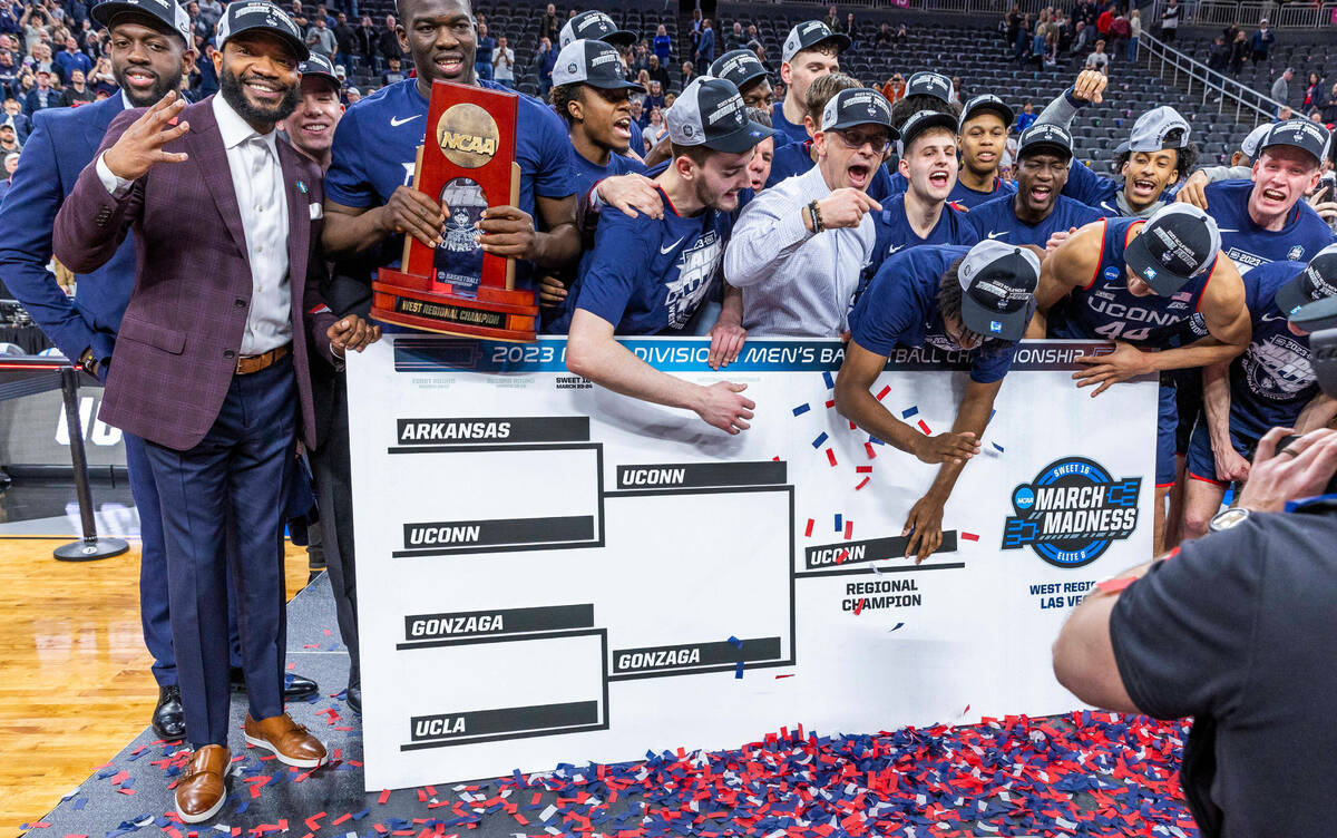 UConn players and coaches celebrate their win over Gonzaga in their West Regional Elite 8 game ...