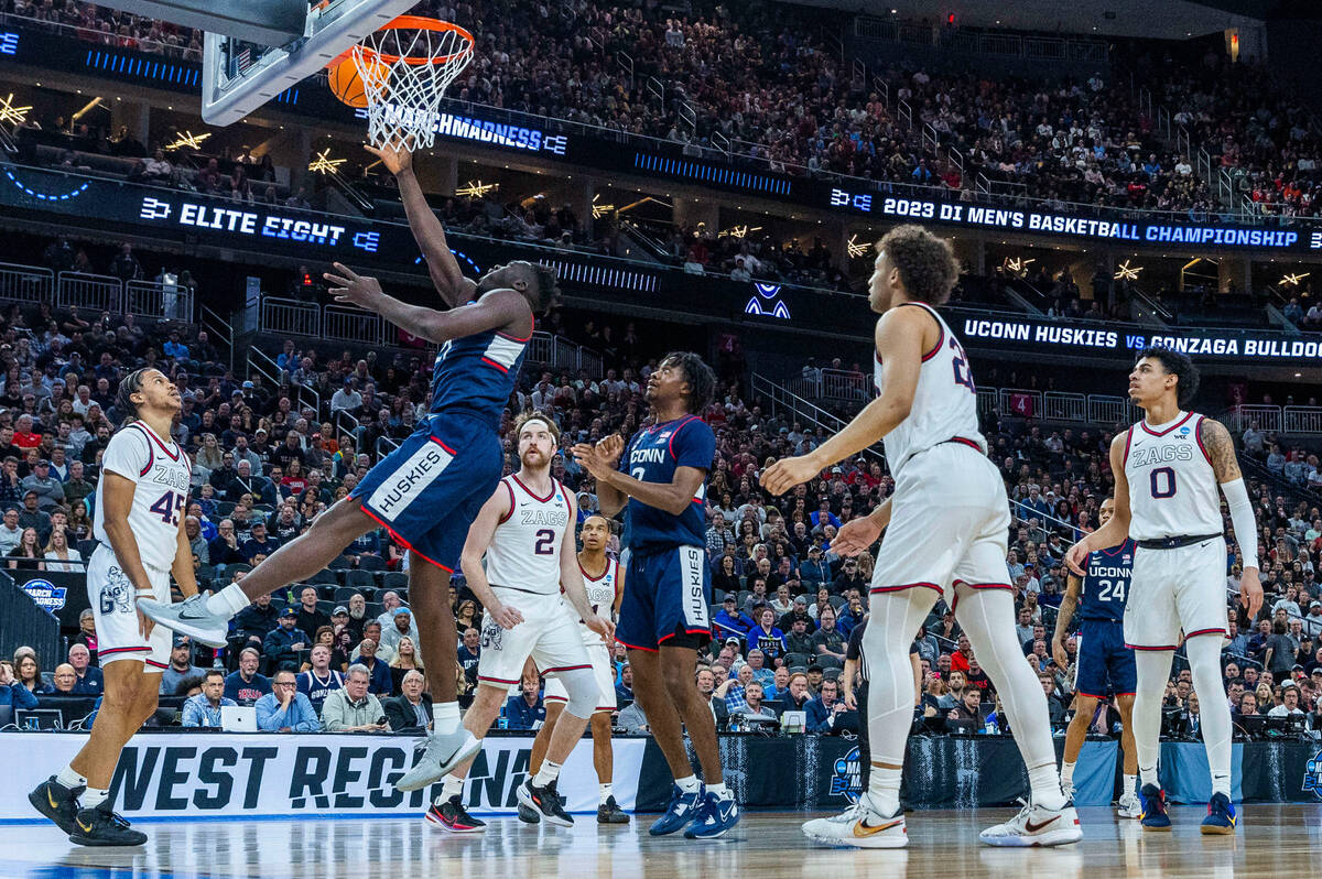 UConn forward Adama Sanogo (21) lays in the ball over Gonzaga during the first half of their We ...