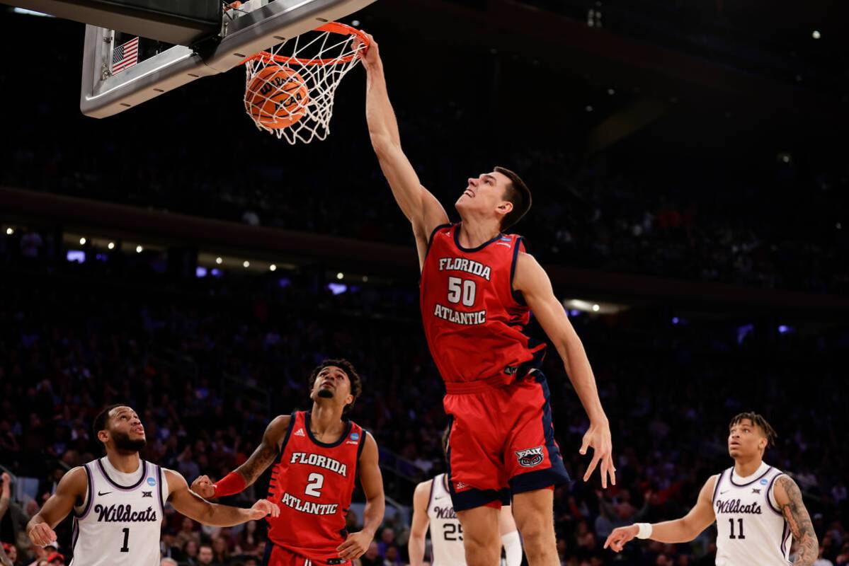 Florida Atlantic's Vladislav Goldin (50) dunks in the second half of an Elite 8 college basketb ...