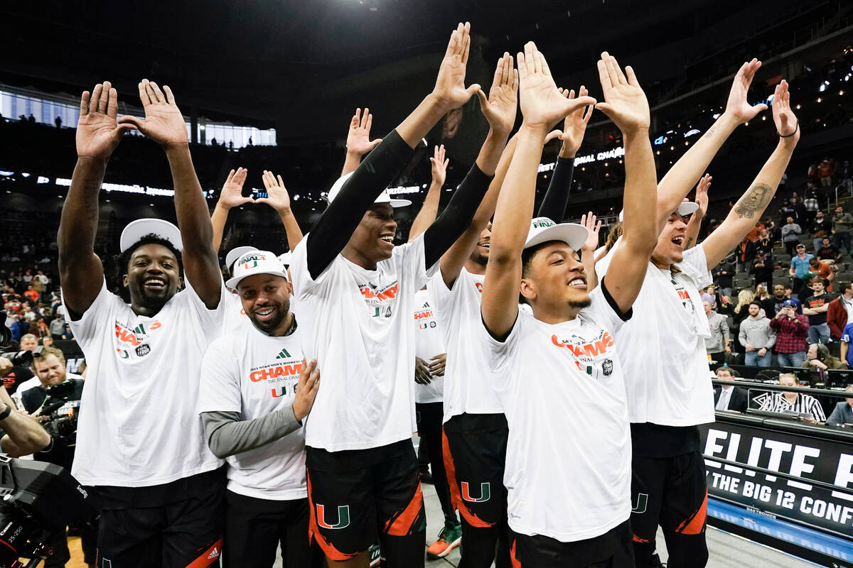 Miami celebrates after their win against Texas in an Elite 8 college basketball game in the Mid ...