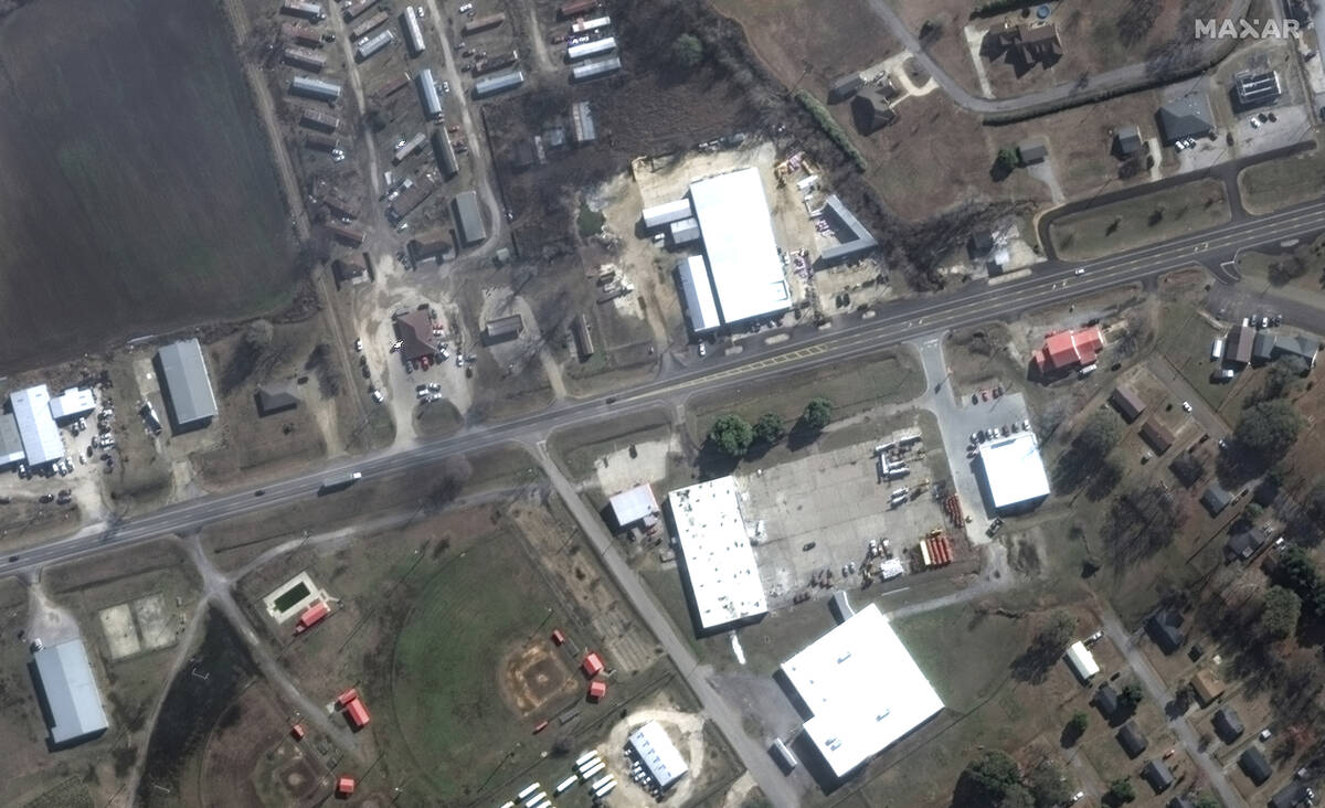 This satellite image provided by Maxar Technologies shows businesses and homes near Blues Highw ...