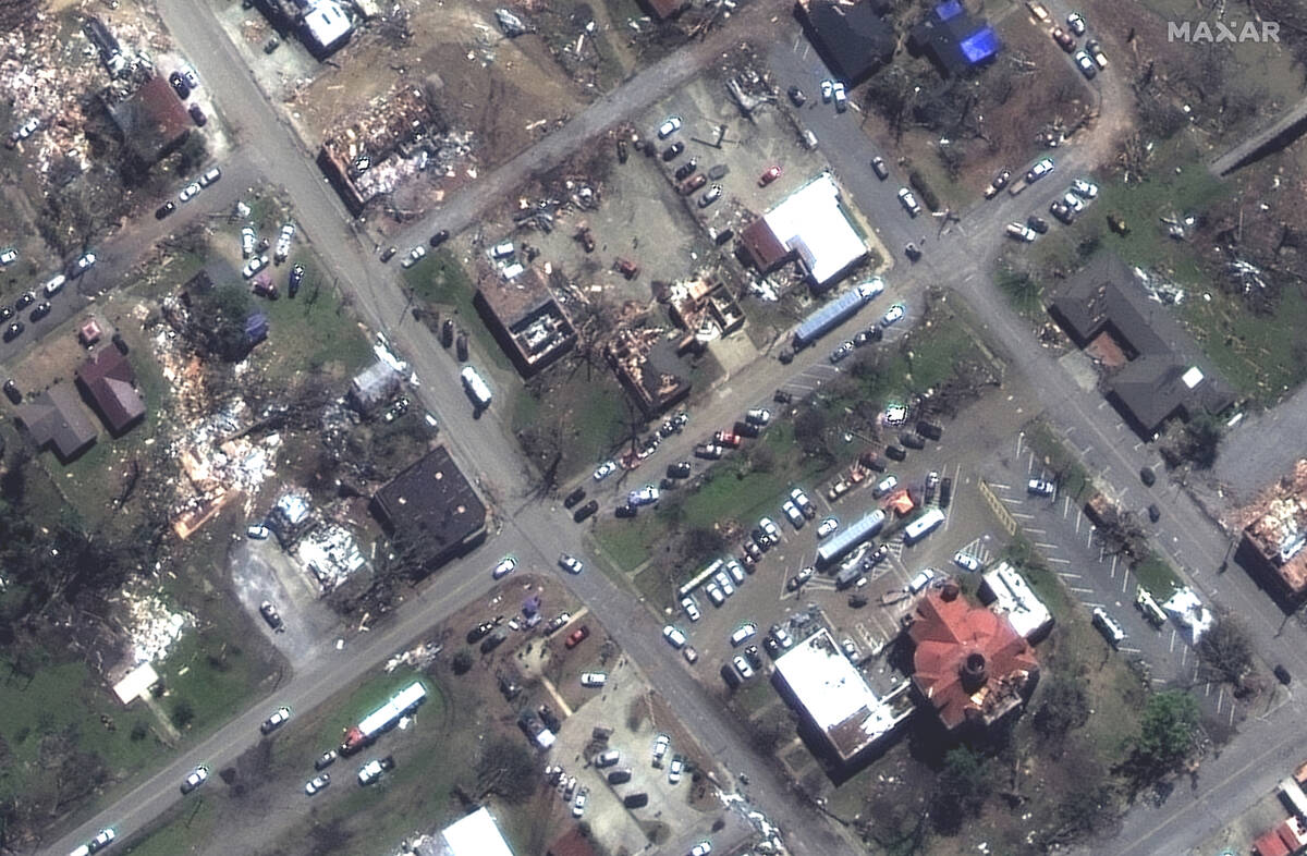 This satellite image provided by Maxar Technologies shows a view of a damaged U.S. Post Office ...