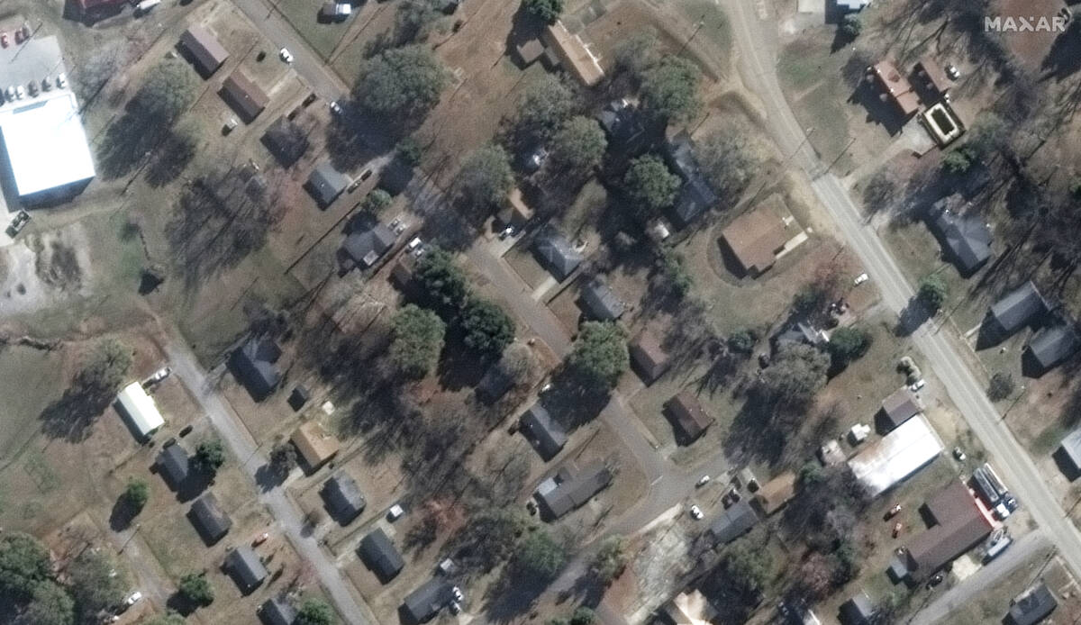 This satellite image provided by Maxar Technologies shows homes along Walnut and Mulberry stree ...