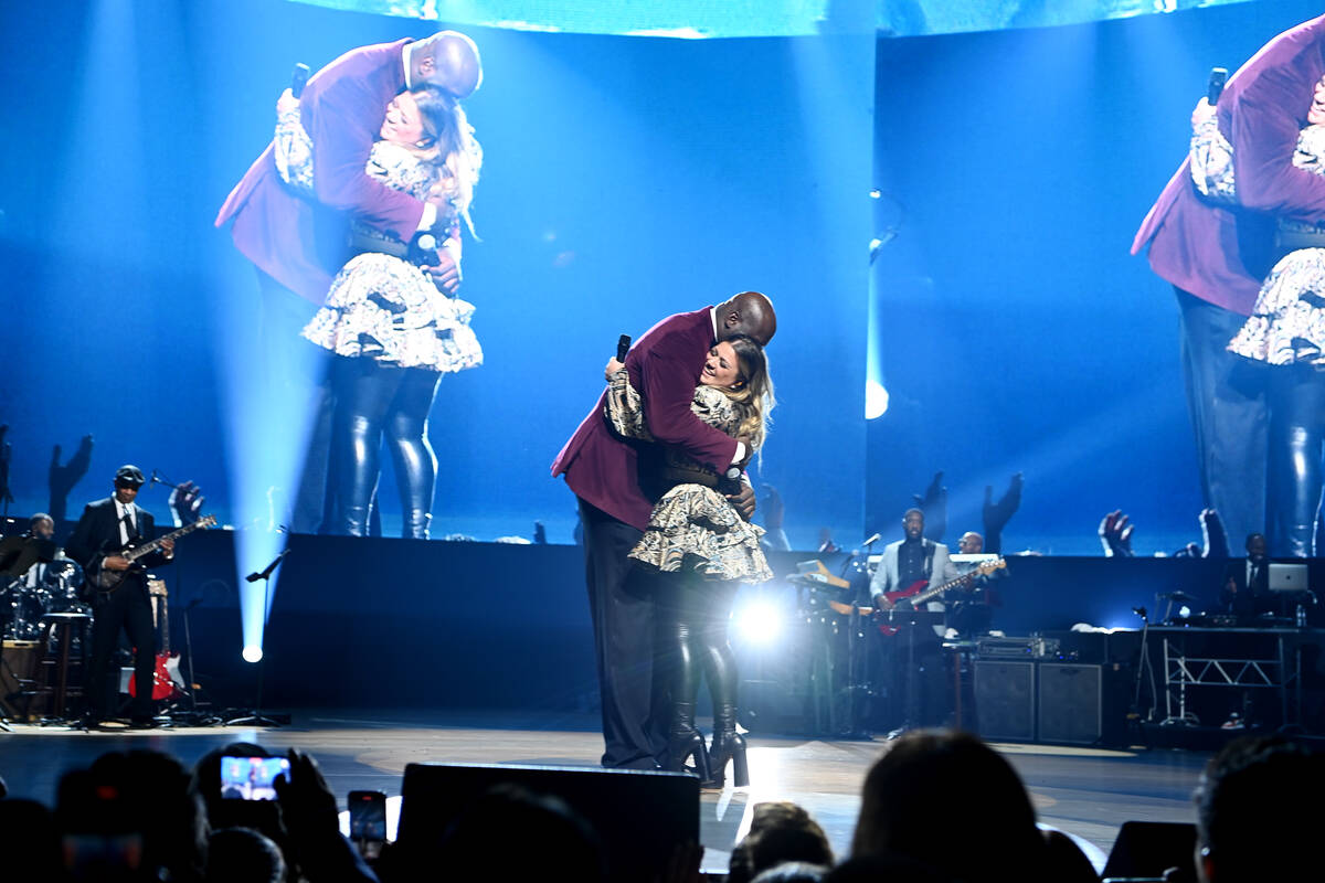 Shaquille O'Neal and Kelly Clarkson are shown at "The Event," a benefit concert for the Shaq Fo ...