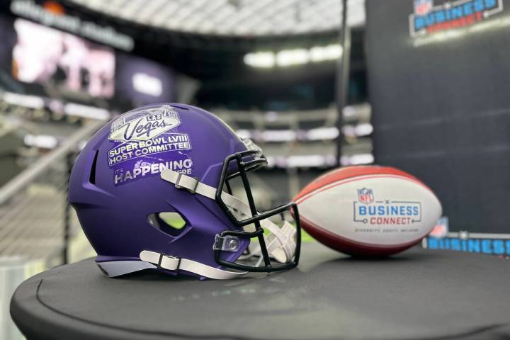 A Las Vegas Super Bowl Host Committee helmet and Business Connect football on display at Allegi ...