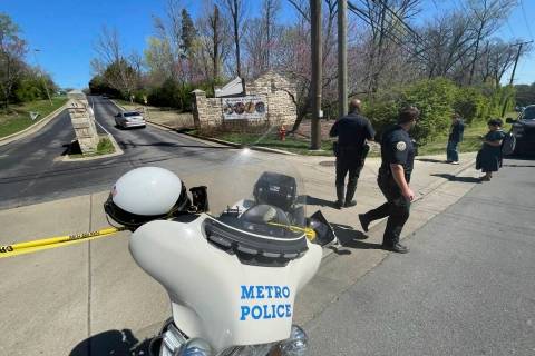 Metro Nashville Police Department officers walk outside of The Covenant School in Nashville, Te ...