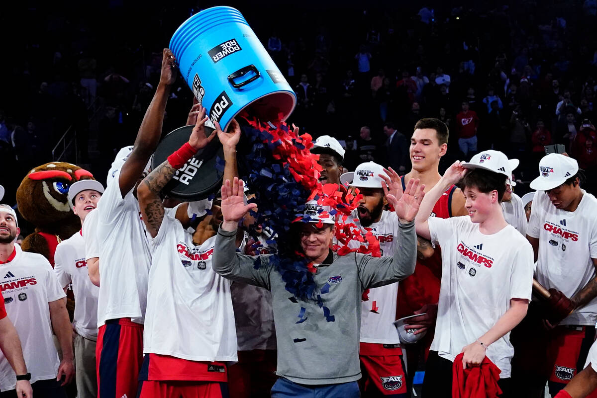 Florida Atlantic players celebrate after defeating Kansas State in an Elite 8 college basketbal ...