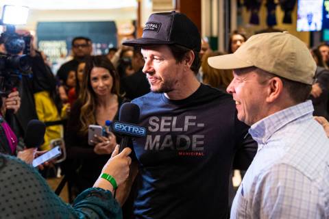 Brothers Mark Wahlberg, left, and Paul Wahlberg are interviewed during the opening celebration ...