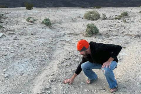 Stuart Jeffries points to Bob Wildoner’s broken sandal in Death Valley National Park. (Doug Kari)