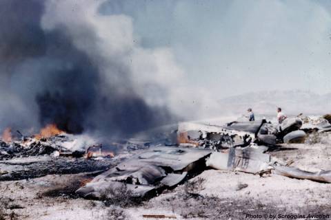 The wreckage of a United Airlines DC-7 smolders in the desert southwest of Las Vegas after a mi ...