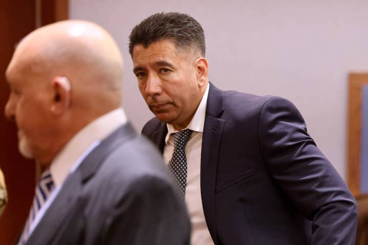 Alpine Motel Apartments former owner Adolfo Orozco, right, looks one of his attorneys Dominic G ...