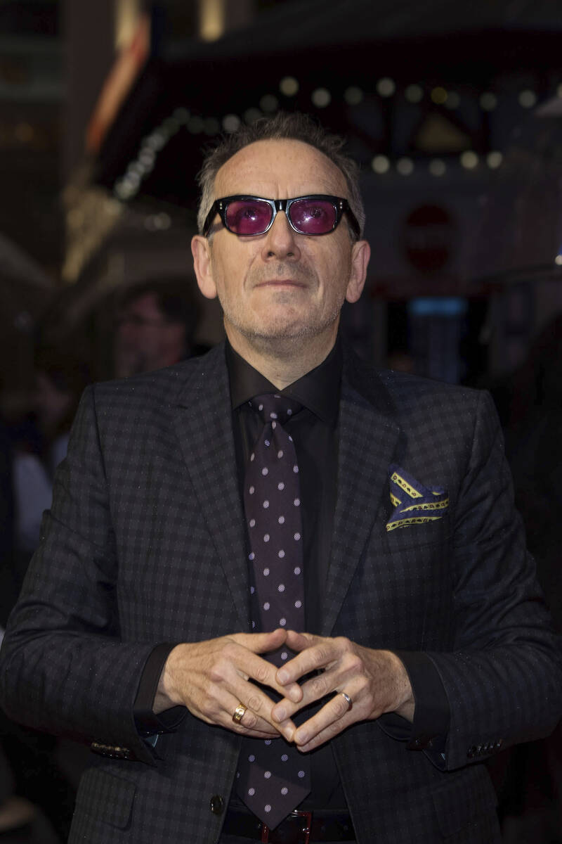 Musician Elvis Costello poses for photographers upon arrival at the premiere of the film 'Film ...