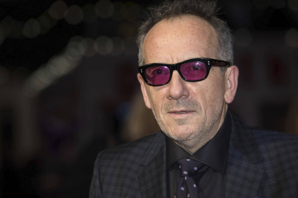 Musician Elvis Costello poses for photographers upon arrival at the premiere of the film 'Film ...