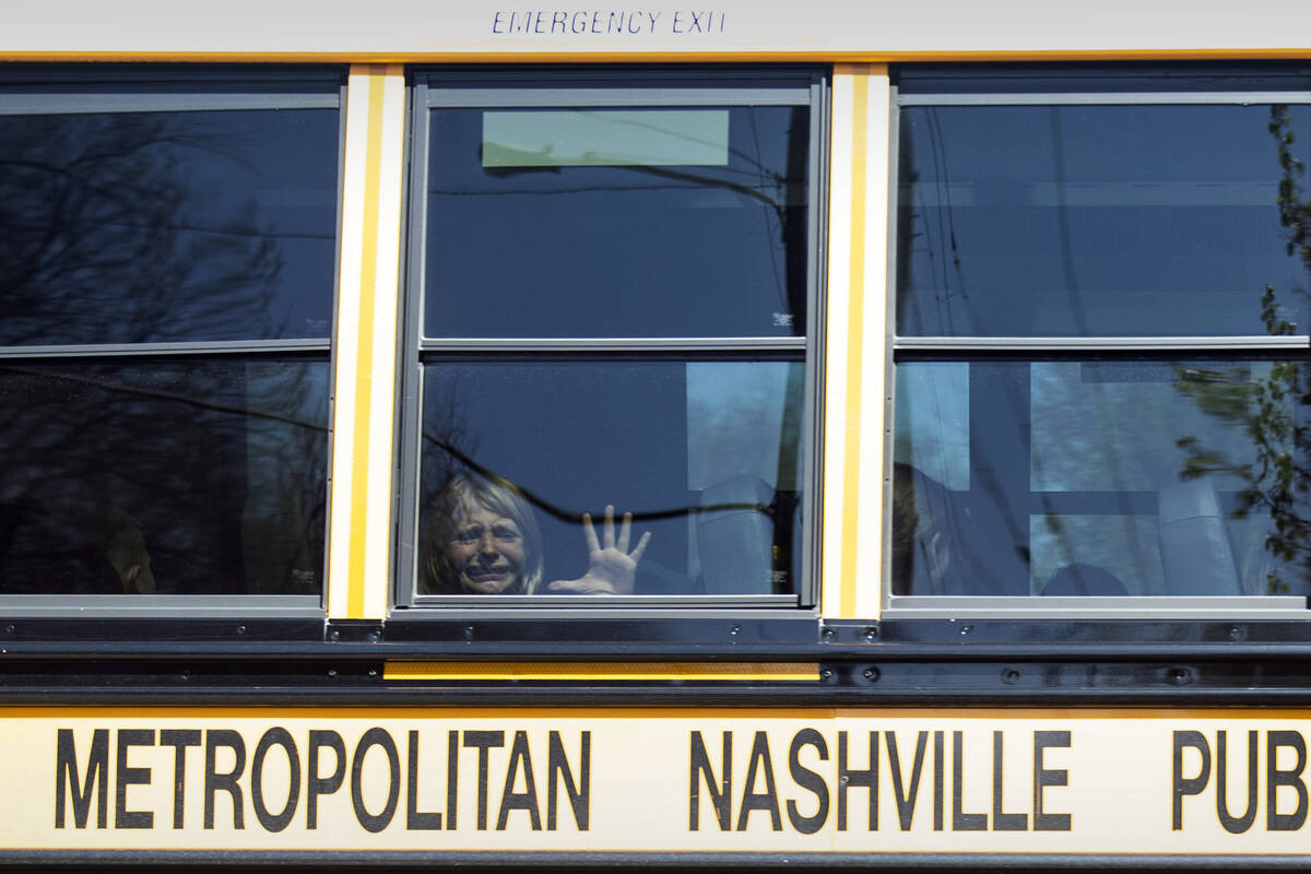 A child weeps while on the bus leaving The Covenant School following a mass shooting at the sch ...