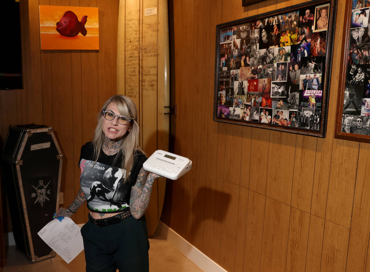 Lisa Brownlee, co-founder of The Punk Rock Museum, prepares to label items on display at her ne ...