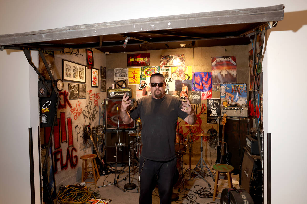 Fletcher Dragge, guitarist for the band Pennywise, shows a recreation of the band’s gara ...
