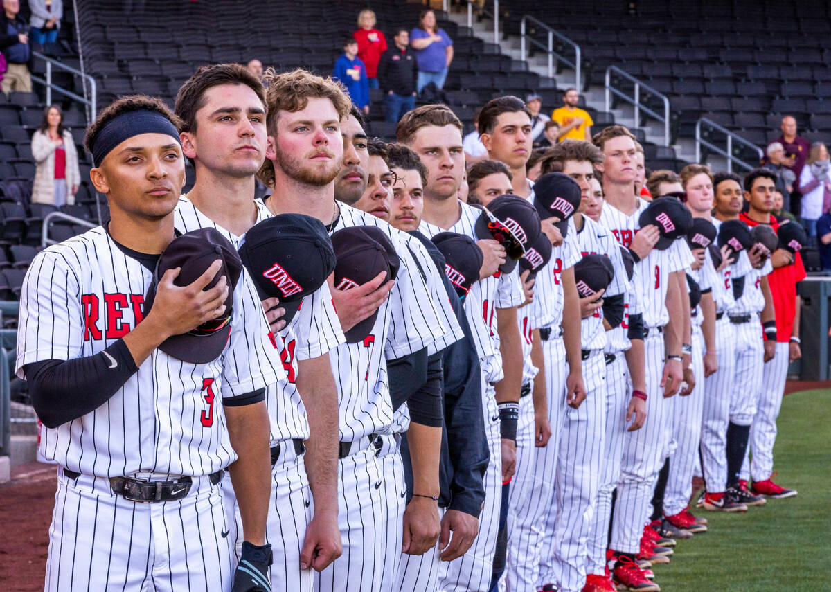 UNLV players stand for the National Anthem before facing Arizona State during the first inning ...