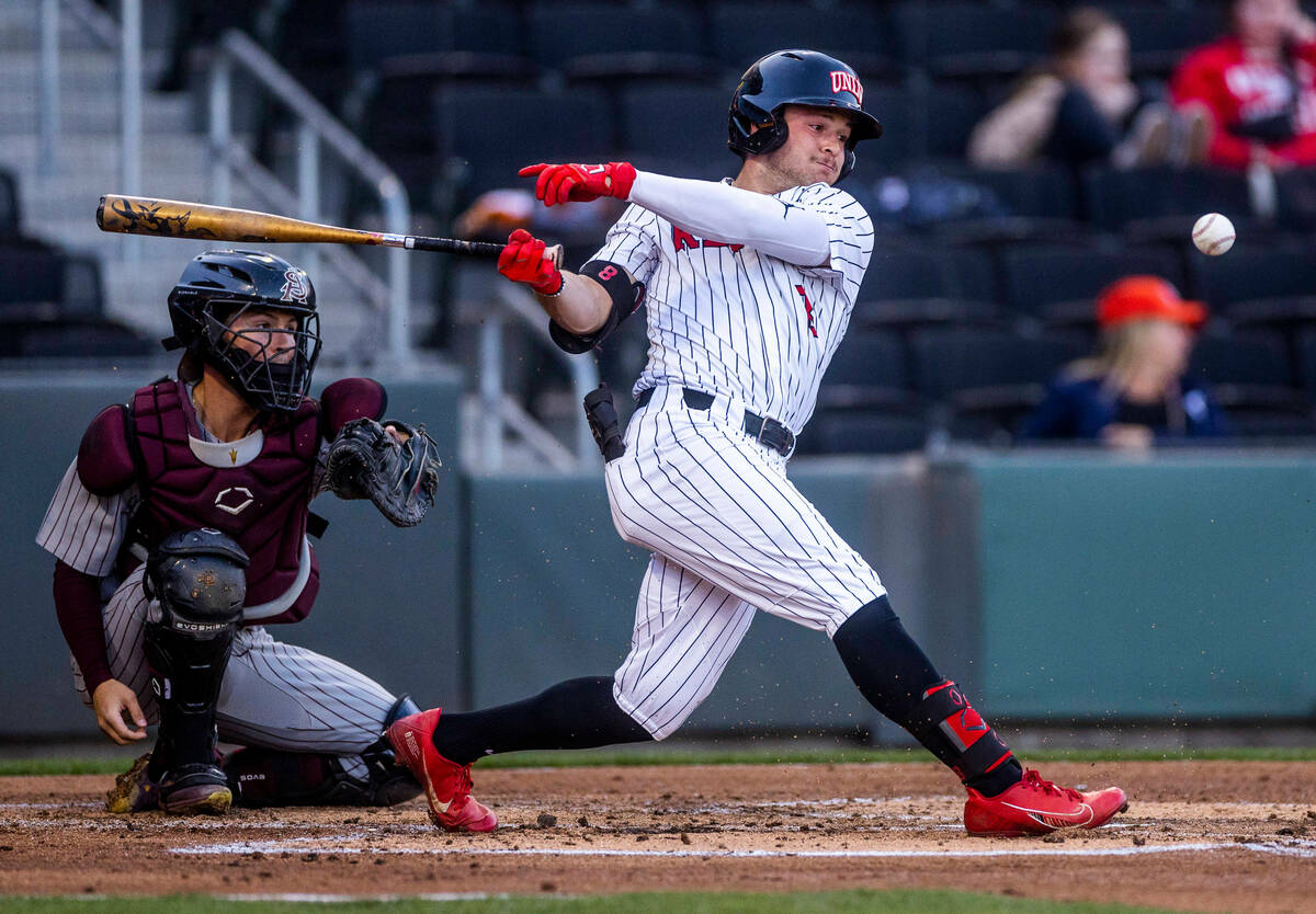 UNLV outfielder Santino Panaro (8) connects on a line drive during the first inning against Ar ...