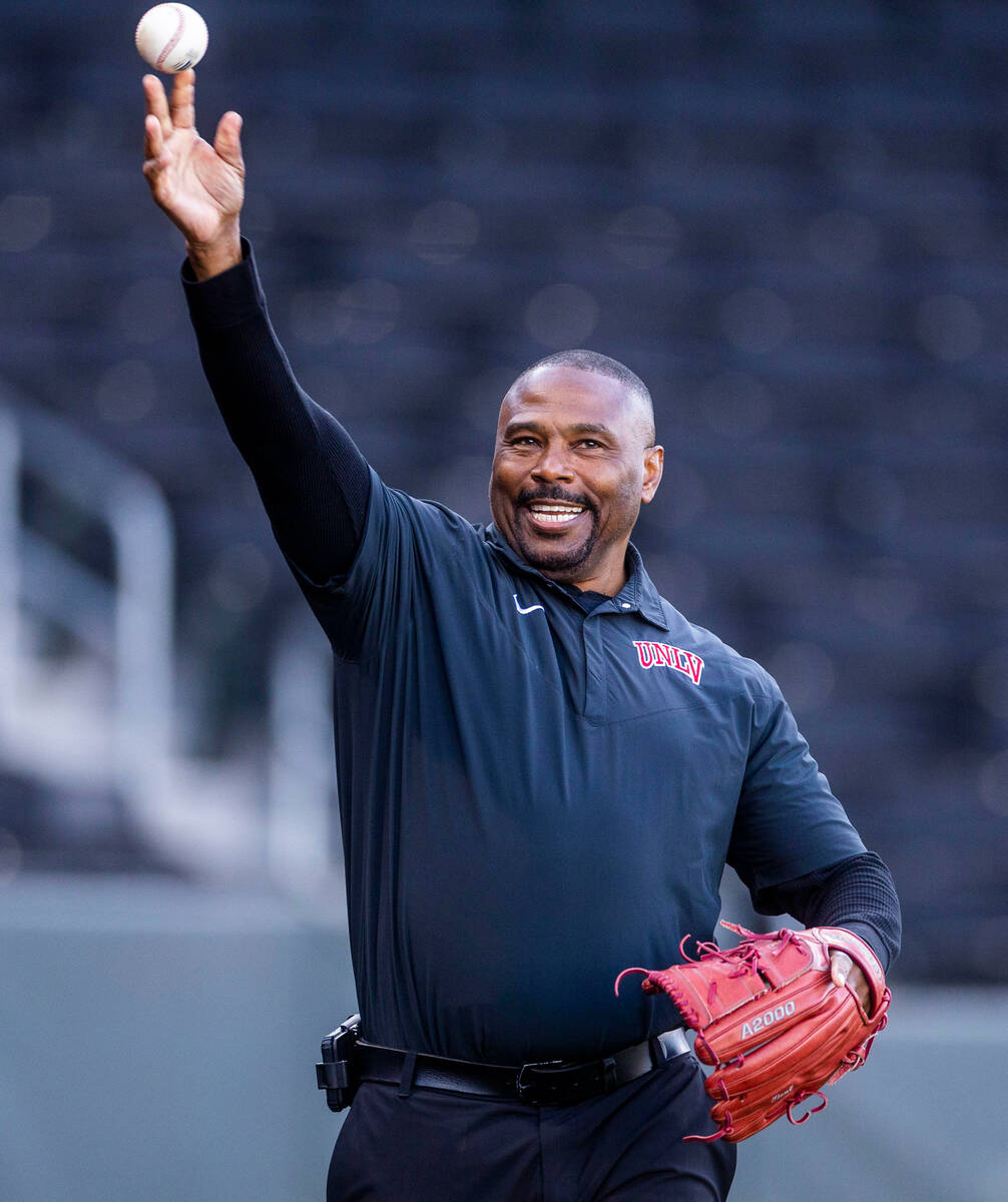 Former UNLV football player Hunkie Cooper throws out the first pitch against Arizona State befo ...