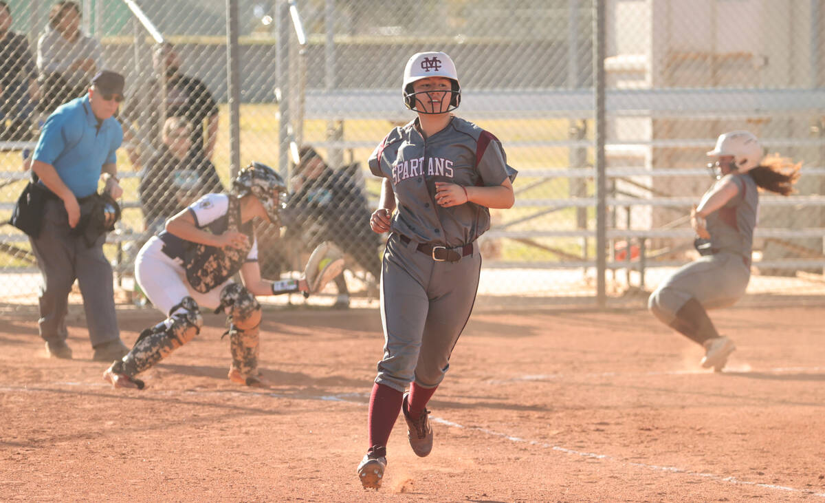 Cimarron-Memorial's Desirae Casique (17) runs to first base as Cimarron-Memorial's Haileigh Sei ...