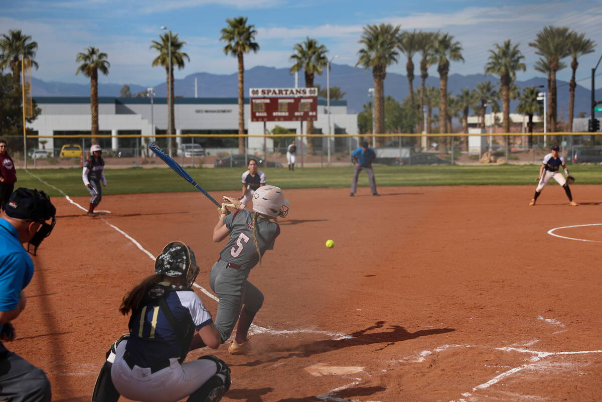 Cimarron-Memorial's Billie Wile (5) hits the ball against Spring Valley during a softball game ...