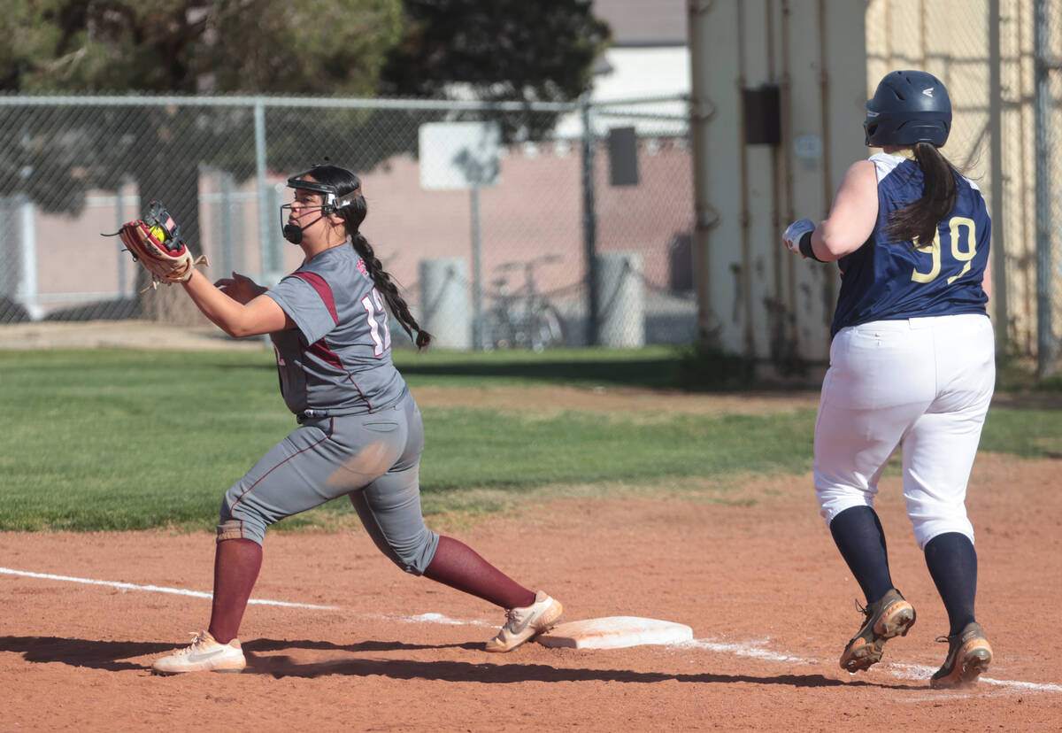 Cimarron-Memorial's Destenny Del Toro (12) catches the ball to force out Spring Valley's Abbi Z ...
