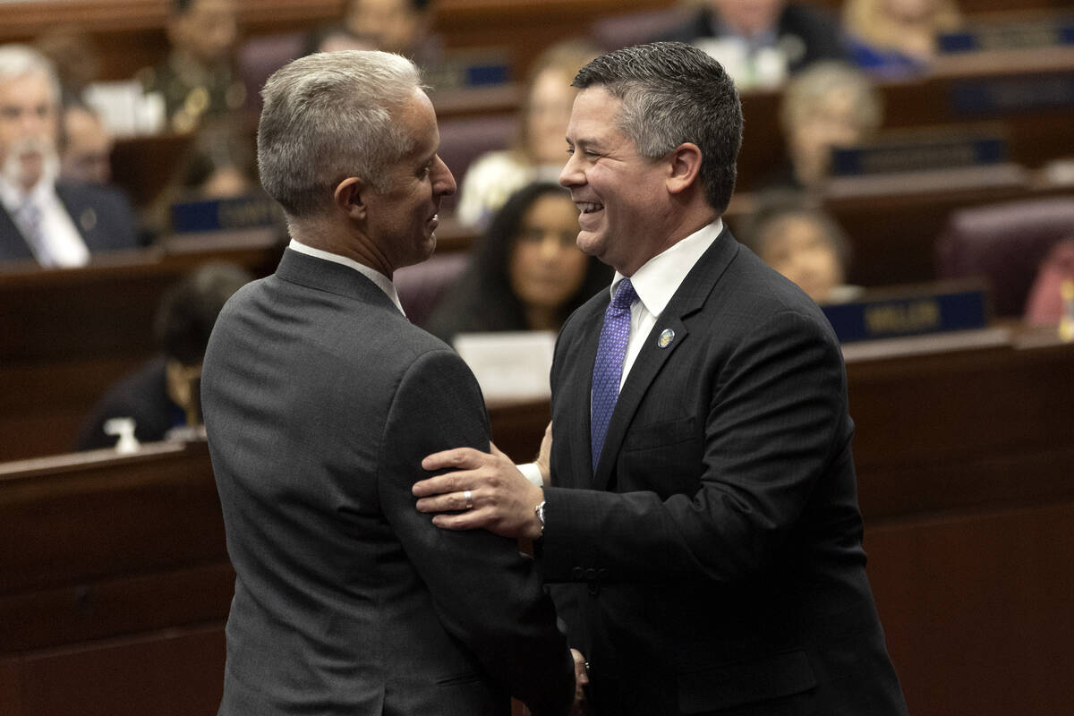 Assemblymen Toby Yurek, R-Henderson, left, and Steve Yeager, D-Las Vegas, greet each other duri ...