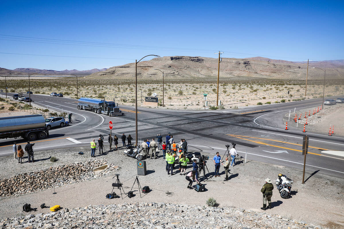 Officials hover around after a press conference in front of the safety transverse rumble strips ...