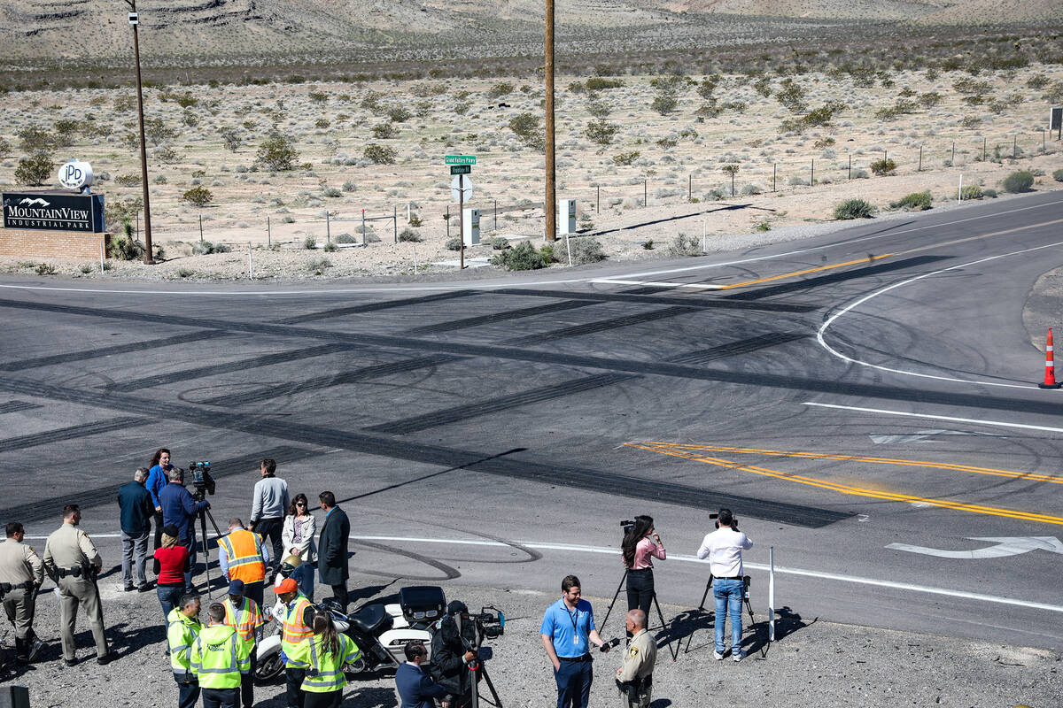 Officials hover around after a press conference in front of the safety transverse rumble strips ...