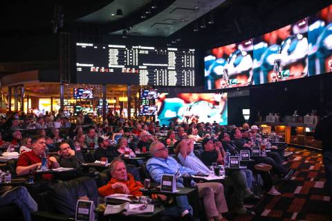 Attendees watch Super Bowl LVII at Caesars Palace sportsbook in Las Vegas, Sunday, Feb. 12, 202 ...